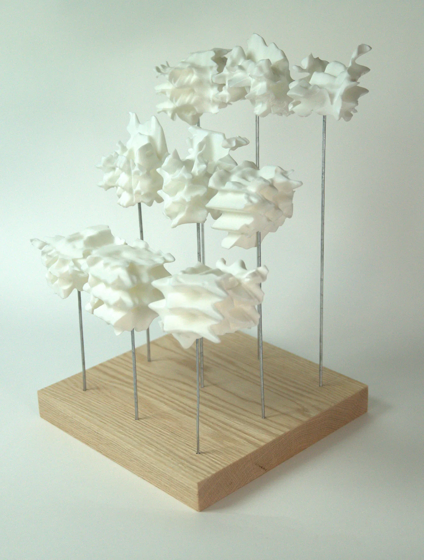 3D-printed masonry unit field assembled on an ash-colored base plate, photographed at 1:50 model scale.